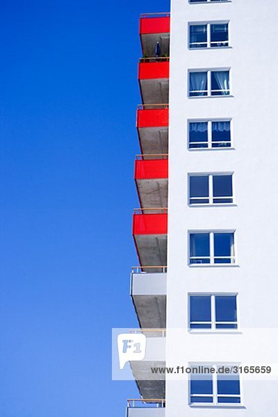 Apartment building with red balconies  Sweden.