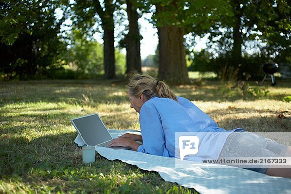 A woman using a laptop Gotland Sweden.