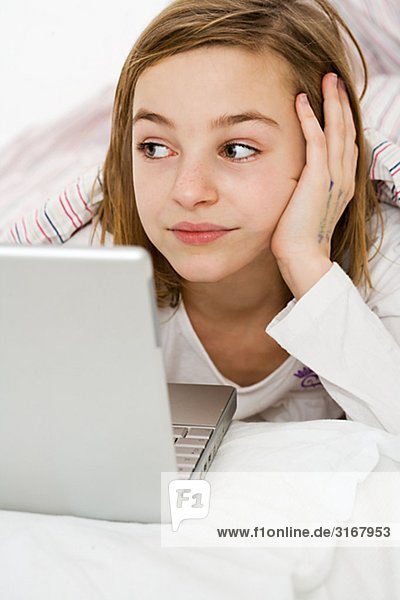 A girl using a laptop.