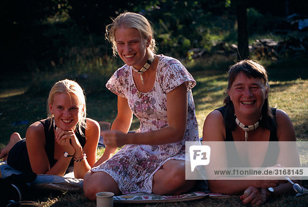 Three women enjoying the sun  Sweden.