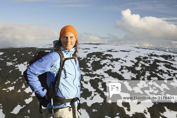 A woman on a mountain peak  Kebnekaise  Lapland  Sweden.