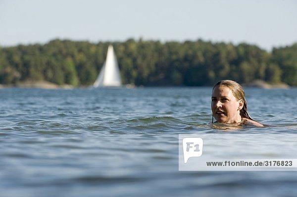 Woman swimming in the sea  Sweden.