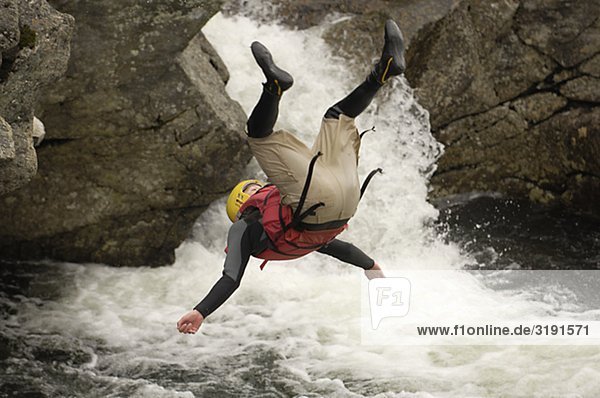 A man jumping into the white water  Sweden.
