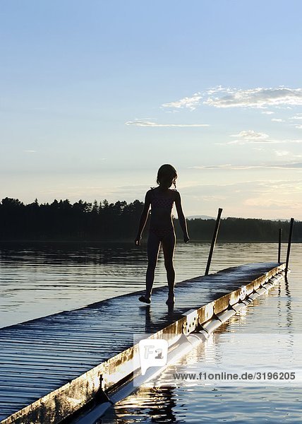 A girl on a jetty.