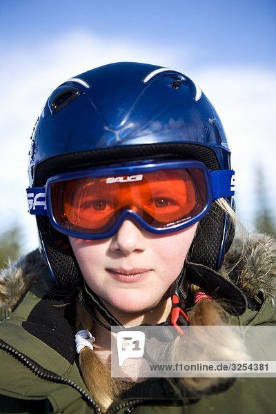 A girl wearing ski goggles Sweden.
