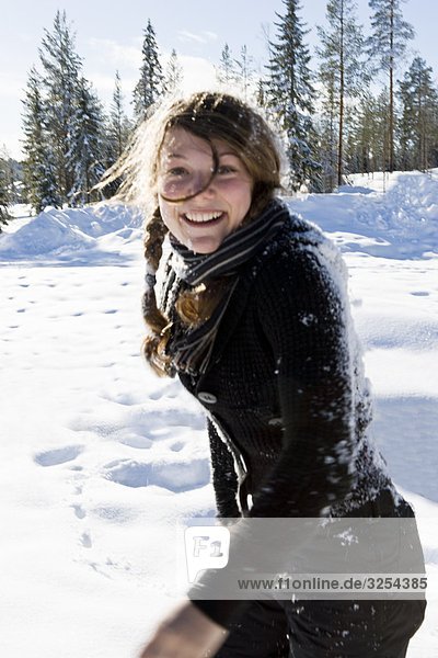 A girl playing in the snow.