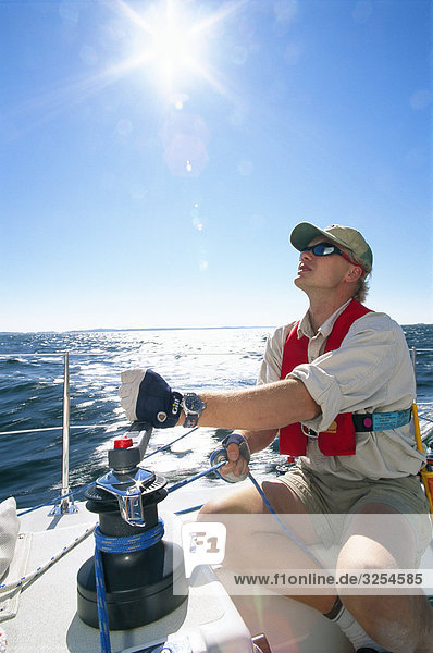 Man on a sailing-boat at sea  the Baltic Sea.