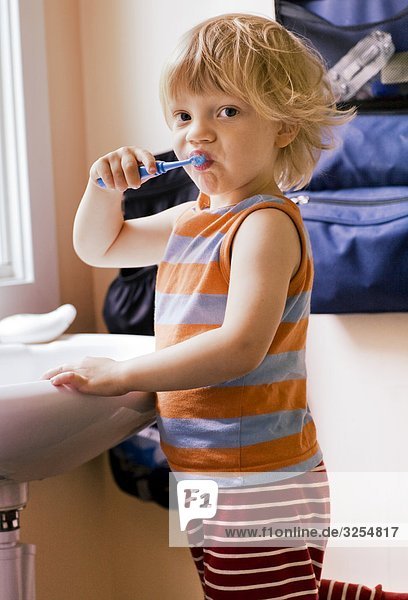A boy brushing his teeth  Sweden.