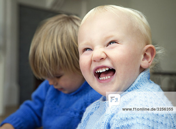 A boy toddler laughing