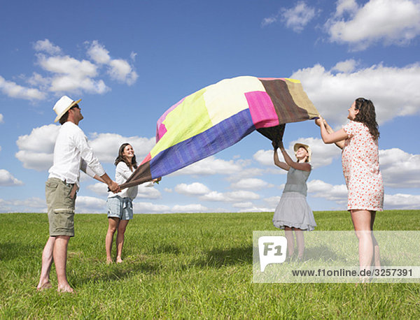 young people with picnic blanket