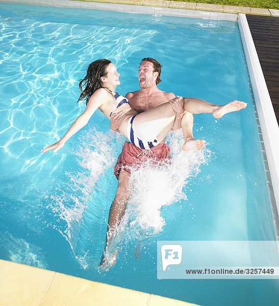 couple falling into pool