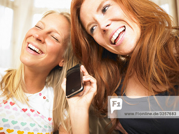 young women using phone