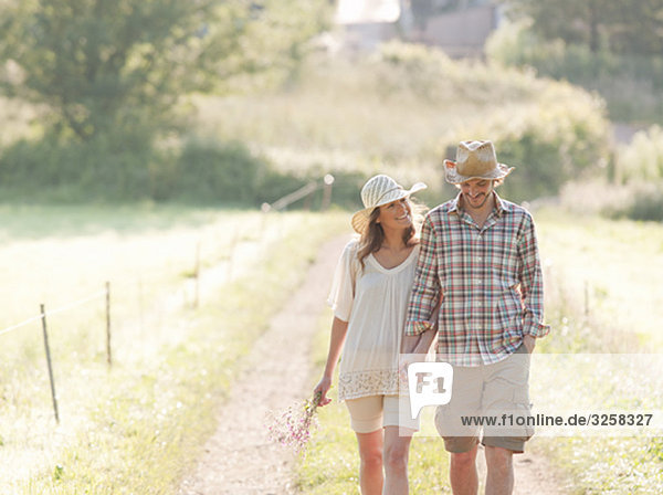 Man and woman walking down lane