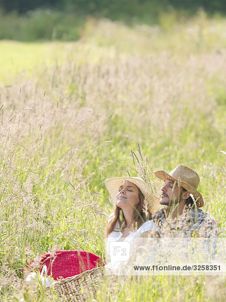 couple in hats eyes closed relaxed