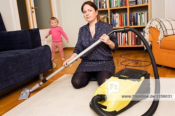 A woman vacuuming  Sweden.