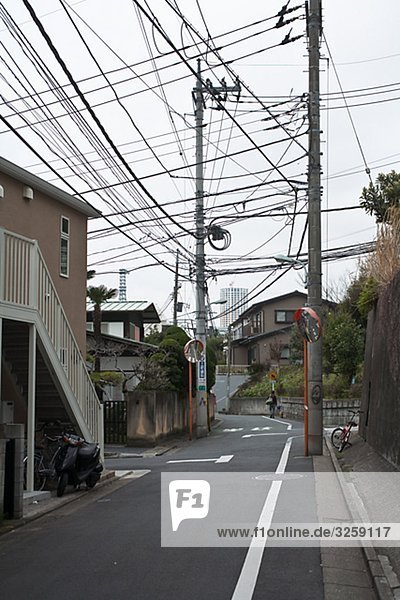 Electric cables over a street  Japan.