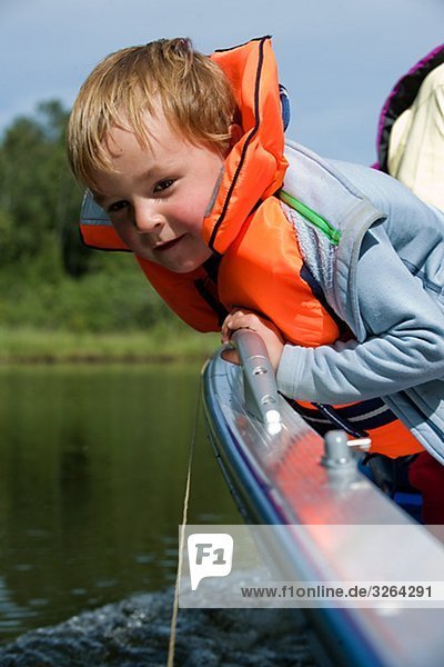 A boy in a boat  Sweden.