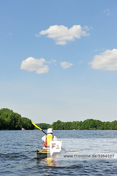 A person paddling kayak  Sweden.