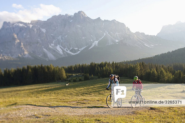 Italy,  Dolomites,  Couple mountainbiking