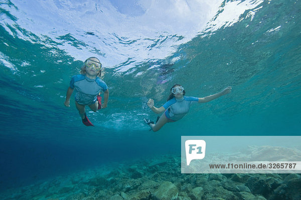 Croatia  Two girls (6-7) (10-11) snorkeling  portrait
