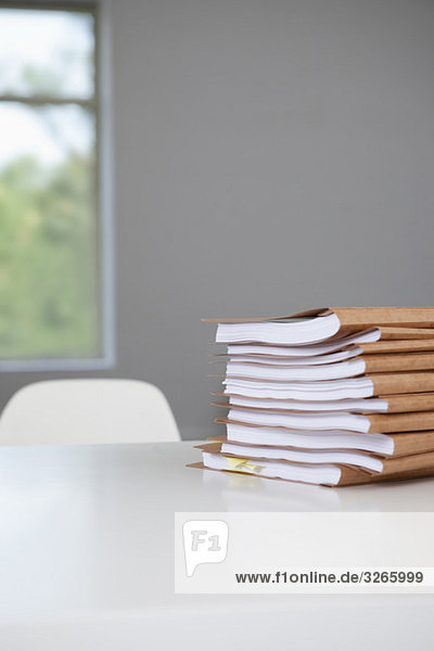Stack of files in conference room