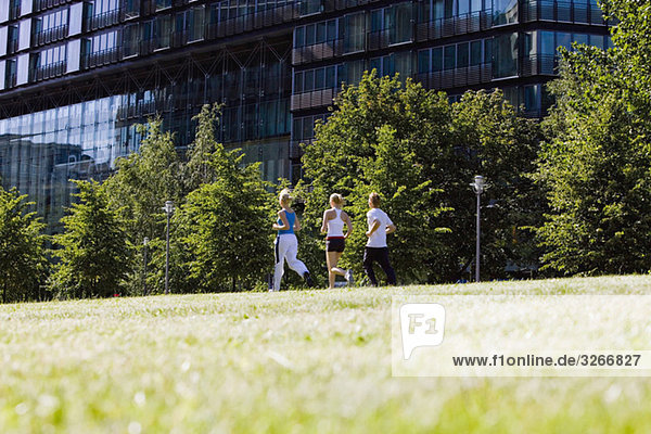 Germany  Berlin  Three persons jogging