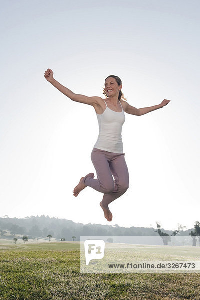 Spain  Mallorca  Woman jumping for joy