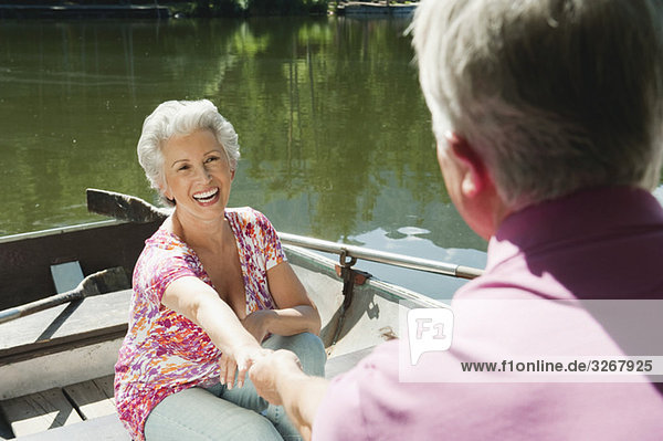Italy  South Tyrol  Senior couple in rowing boat  portrait