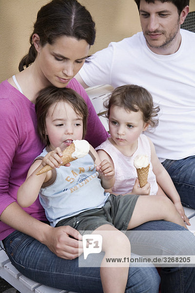 Germany  Berlin  Family with children (2-4) holding ice cream