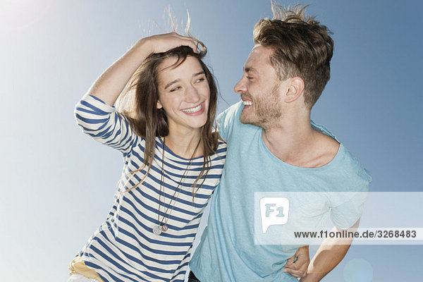 Germany  Berlin  Young couple laughing  portrait