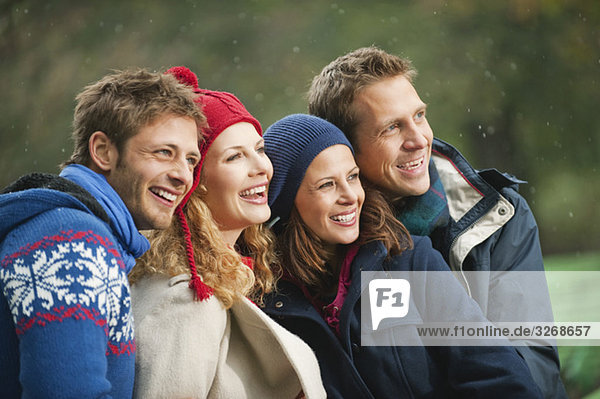 Germany  Bavaria  English Garden  Four persons laughing  portrait  close-up