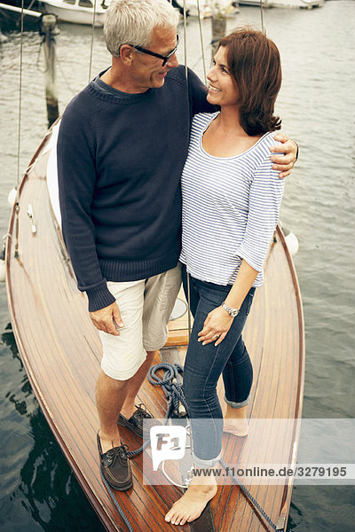 Middle aged couple on an old boat