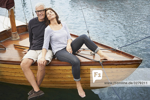 Middle aged couple on old boat