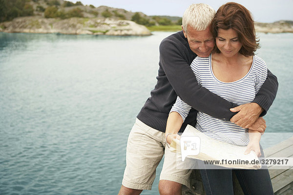 Middle aged couple with map