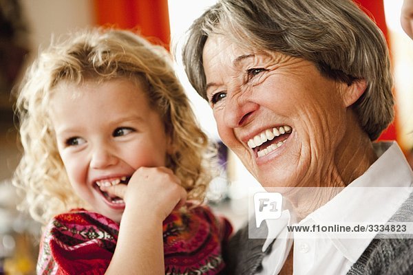 grandma and grandchildren laughing