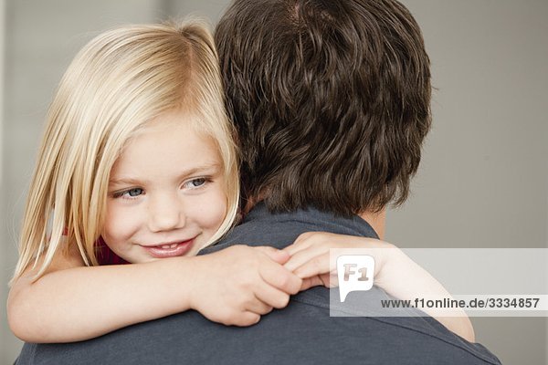 father and daughter hugging