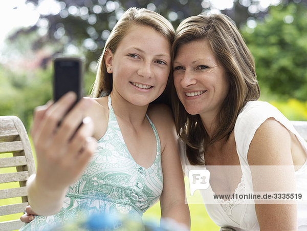 mum and daughter pose for self-portrait