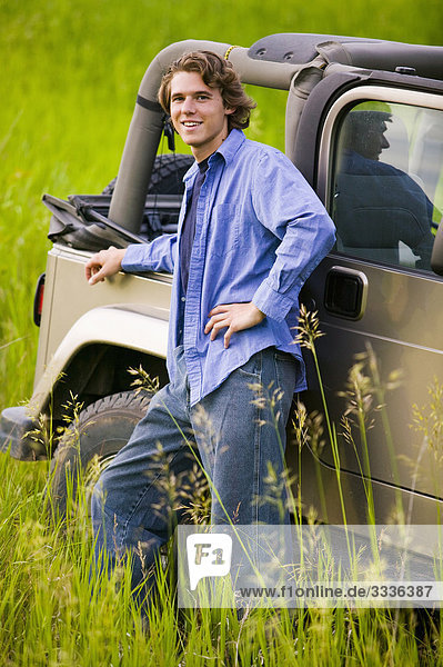 Portrait of man leaning on jeep  off road  Bradford  Ontario