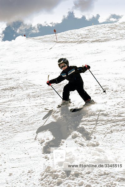 A skiing boy in the snow  Italy.