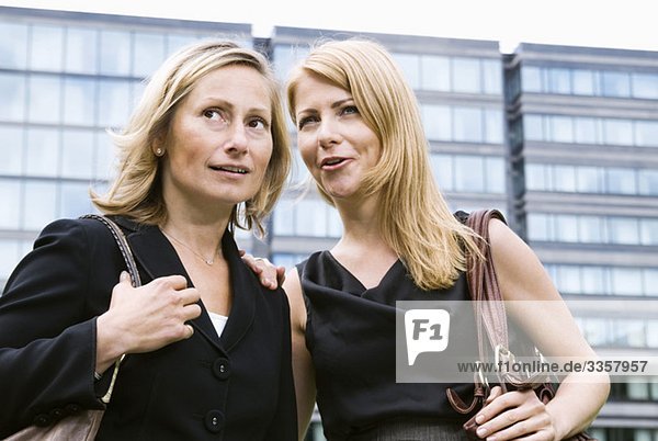 Closeup on two businesswomen outdoors