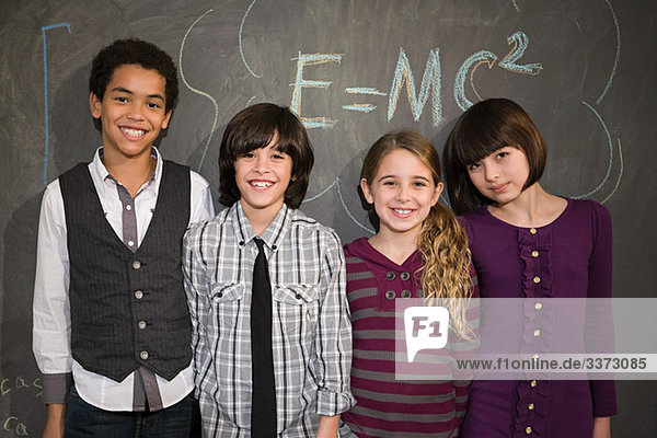 Children in front of blackboard