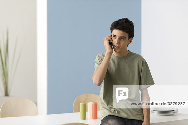Teenage boy using cell phone