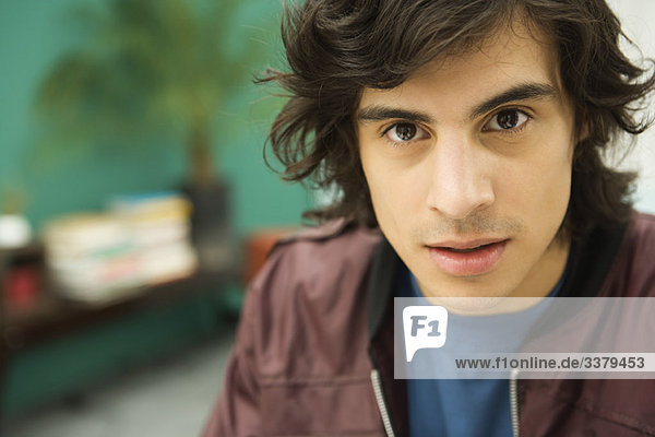 Young man staring at camera  portrait