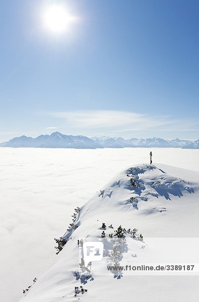 Memorial cross on a mountain peak Berchtesgaden Alps Austria elevated view