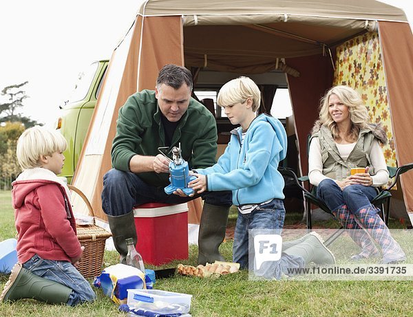 Family setting up camp