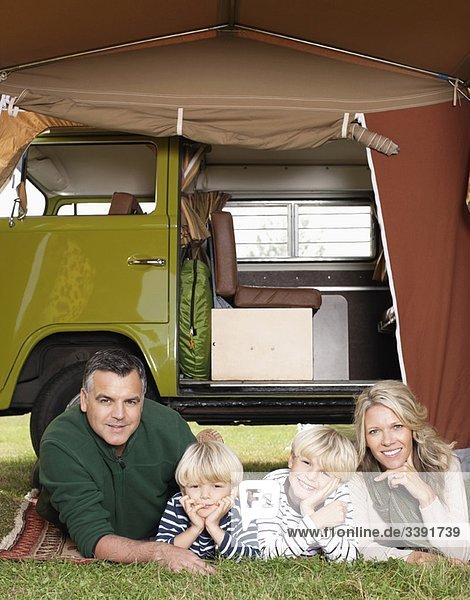 Family in front of camper van