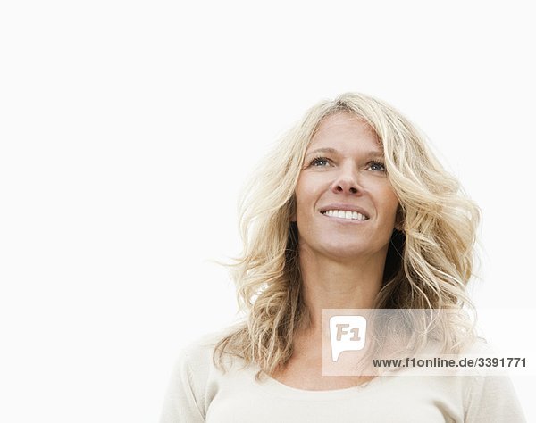 Smiling woman looking away from camera