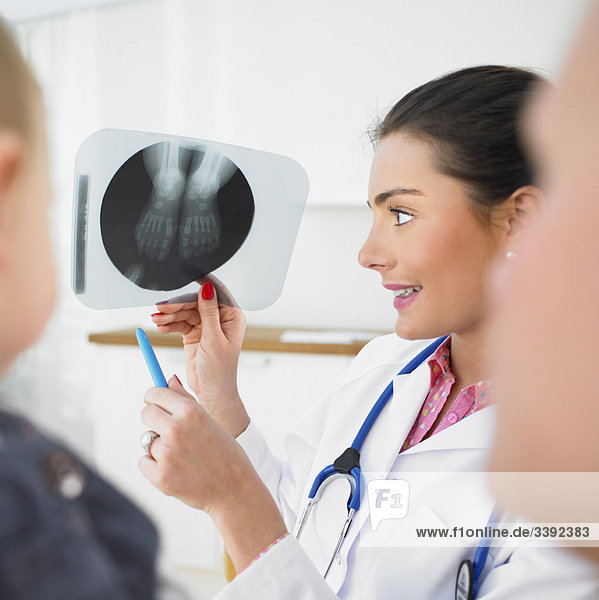 Pediatrician showing X-ray