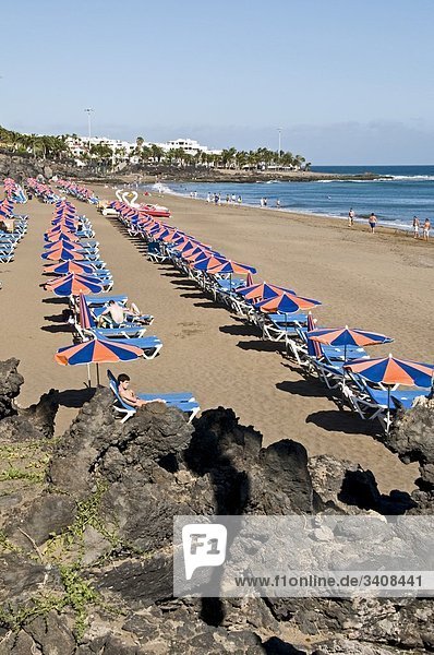 Tourists on the beach  Puerto del Carmen  Lanzarote  Spain  elevated view