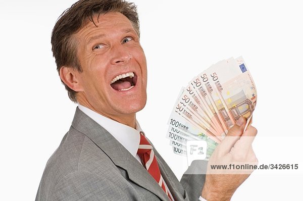 Geschäftsmann mit Euro-Banknoten  Seitenansicht  Portrait  Nahaufnahme